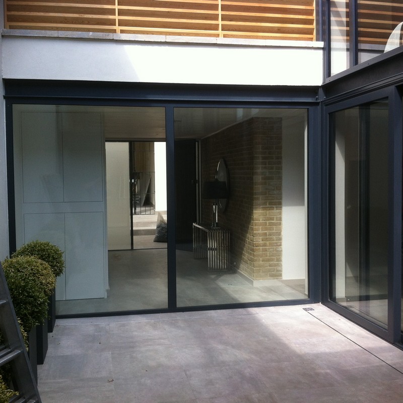 Floor-to-ceiling sliding doors opening to courtyard in West Brompton